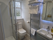 Room 8 - Heated towel rails and backlit mirror